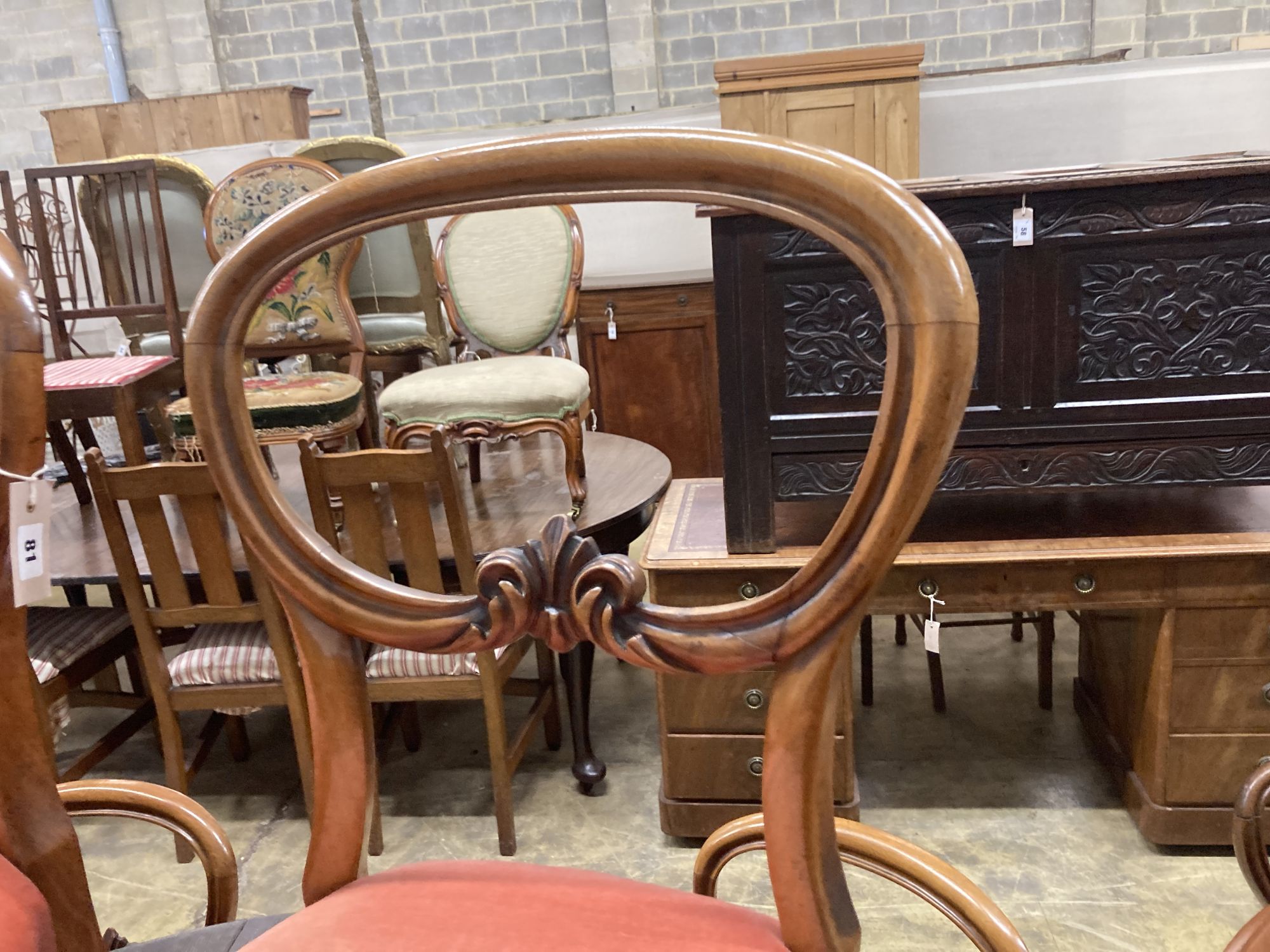 A set of four Victorian mahogany balloon back dining chairs